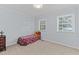 Cozy bedroom with carpet and Mickey Mouse bedding at 402 Sparella St, Durham, NC 27703