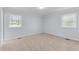 Spacious bedroom with light walls and carpet flooring at 402 Sparella St, Durham, NC 27703