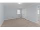 Bright bedroom with carpet, large closet, and window at 402 Sparella St, Durham, NC 27703