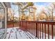 Wooden deck overlooking backyard with light snow at 402 Sparella St, Durham, NC 27703