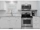 Modern kitchen with stainless steel appliances and granite countertops at 402 Sparella St, Durham, NC 27703