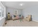 Bright living room with light flooring and comfy seating at 402 Sparella St, Durham, NC 27703