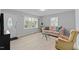 Living room with hardwood floors and large window at 402 Sparella St, Durham, NC 27703