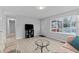 Spacious living room with hardwood floors and large window at 402 Sparella St, Durham, NC 27703