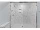 Large walk-in shower with marble tile and glass enclosure at 402 Sparella St, Durham, NC 27703