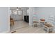 Bright sunroom with two armchairs, a ceiling fan, and wood-look flooring at 402 Sparella St, Durham, NC 27703