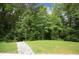 Landscaped backyard with lush greenery and trees at 508 Lakeland St # A, Durham, NC 27701