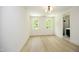 Bright bedroom with two windows and wood floors at 508 Lakeland St # A, Durham, NC 27701