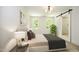 Spacious bedroom with large windows and wood floors at 508 Lakeland St # A, Durham, NC 27701