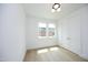 Bright bedroom with hardwood floors, large window, and double closets at 508 Lakeland St # A, Durham, NC 27701
