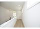 Bright hallway with light wood floors and white walls at 508 Lakeland St # A, Durham, NC 27701