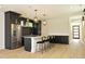 Modern kitchen with dark cabinetry, stainless steel appliances, and an island at 508 Lakeland St # A, Durham, NC 27701