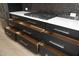 Dark kitchen cabinets with ample drawers and elegant gold handles at 508 Lakeland St # A, Durham, NC 27701