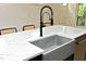 Quartz countertop kitchen island with a concrete sink and modern black faucet at 508 Lakeland St # A, Durham, NC 27701