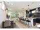 Open concept kitchen with island, stainless steel appliances, and dark cabinets at 508 Lakeland St # A, Durham, NC 27701