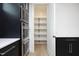 Walk-in pantry with bright white shelves offering ample storage at 508 Lakeland St # A, Durham, NC 27701