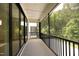 Screened porch with sliding glass doors and view of backyard at 508 Lakeland St # A, Durham, NC 27701