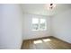 Bright bedroom with hardwood floors and large windows at 508 Lakeland St # B, Durham, NC 27701