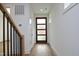 Light and airy entryway with hardwood floors and a modern staircase at 508 Lakeland St # B, Durham, NC 27701