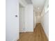 Bright hallway with hardwood floors and white walls at 508 Lakeland St # B, Durham, NC 27701