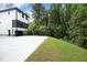 Modern two-story house with a large driveway and wooded backyard at 508 Lakeland St # B, Durham, NC 27701
