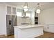 Modern kitchen with white cabinets, quartz countertops and gold accents at 508 Lakeland St # B, Durham, NC 27701