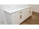 White kitchen cabinets with gold handles and quartz countertop at 508 Lakeland St # B, Durham, NC 27701