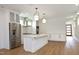 Modern kitchen with white cabinets, quartz countertops, and stainless steel appliances at 508 Lakeland St # B, Durham, NC 27701