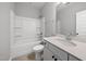 Well-lit bathroom featuring a shower-tub combo and a modern vanity with sleek fixtures at 51 Pansy Park # 234, Clayton, NC 27520