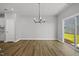 Bright dining room with wood flooring and a sliding door to the outdoor space at 51 Pansy Park # 234, Clayton, NC 27520