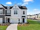 Charming two-story home with landscaped yard, driveway, and attached garage, offering a welcoming curb appeal at 51 Pansy Park # 234, Clayton, NC 27520