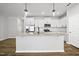 Modern kitchen with white cabinets, granite countertops, and stainless steel appliances, blending style and functionality at 51 Pansy Park # 234, Clayton, NC 27520