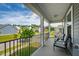 Relax on the balcony with comfortable seating and enjoy neighborhood views in this charming home at 528 Ballast Pt, Clayton, NC 27520