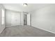 Neutral bedroom with carpet, white doors, and plenty of natural light at 528 Ballast Pt, Clayton, NC 27520