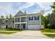 Charming two-story home with a double porch, landscaped yard, and two car garage at 528 Ballast Pt, Clayton, NC 27520