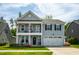 Beautiful two-story home featuring a welcoming porch, attached two-car garage, and lovely landscaping at 528 Ballast Pt, Clayton, NC 27520