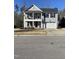 Charming home boasts a welcoming porch, two-car garage, and classic design at 528 Ballast Pt, Clayton, NC 27520