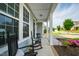 Inviting front porch with rocking chairs and lush landscaping provides shade and curb appeal at 528 Ballast Pt, Clayton, NC 27520