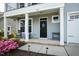 Inviting front porch with rocking chairs and a charming wreath on the front door at 528 Ballast Pt, Clayton, NC 27520