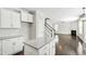 Bright kitchen features white cabinets, granite countertops and stainless steel appliances at 528 Ballast Pt, Clayton, NC 27520