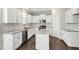 Modern kitchen with stainless steel appliances, granite countertops, and ample cabinet space at 528 Ballast Pt, Clayton, NC 27520