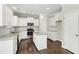 Modern kitchen with stainless steel appliances, granite countertops, and ample cabinet space at 528 Ballast Pt, Clayton, NC 27520