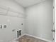 Well-equipped laundry room with a wire shelf and utility connections at 528 Ballast Pt, Clayton, NC 27520