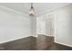 Spacious living room with hardwood floors and an open layout, illuminated by a chandelier at 528 Ballast Pt, Clayton, NC 27520