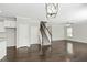Open concept living room featuring wood floors and a staircase to the upper level at 528 Ballast Pt, Clayton, NC 27520