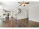 Spacious open-concept living room featuring wood floors, and modern ceiling fan at 528 Ballast Pt, Clayton, NC 27520
