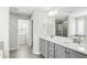 Main bathroom featuring double vanity, bathtub, and tiled floors at 528 Ballast Pt, Clayton, NC 27520