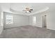 Spacious main bedroom features trey ceiling, carpet, and natural light at 528 Ballast Pt, Clayton, NC 27520