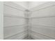 Walk-in pantry with multiple shelves for storage at 528 Ballast Pt, Clayton, NC 27520