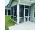Cozy screened porch with seating for relaxing and enjoying the outdoors at 528 Ballast Pt, Clayton, NC 27520